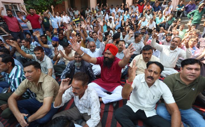 PHE daily wagers during a protest-dharna outside the office of Chief Engineer at BC Road, Jammu.