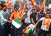 Bajrang Dal activists burning Pakistan flags during a protest in Jammu on Monday.