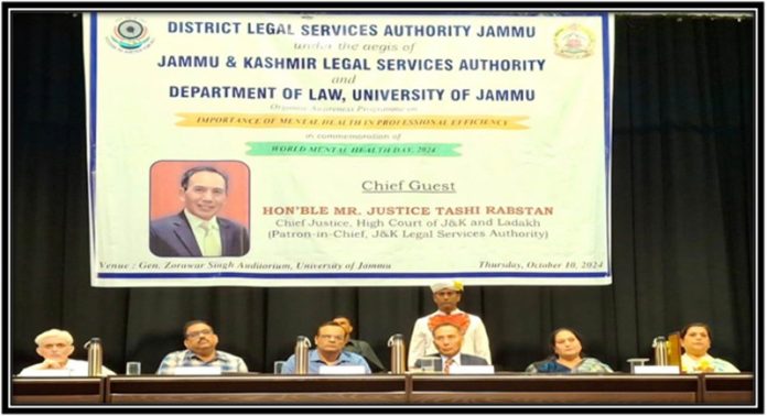 Justice Tashi Rabstan presiding over an awareness programme at General Zorawar Singh Auditorium, University of Jammu.