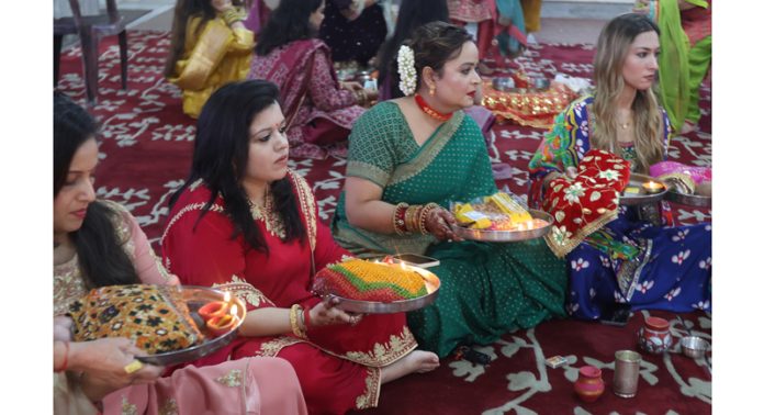 Women performing religious rituals during Karvachauth festival in Jammu on Sunday. —Excelsior/Rakesh