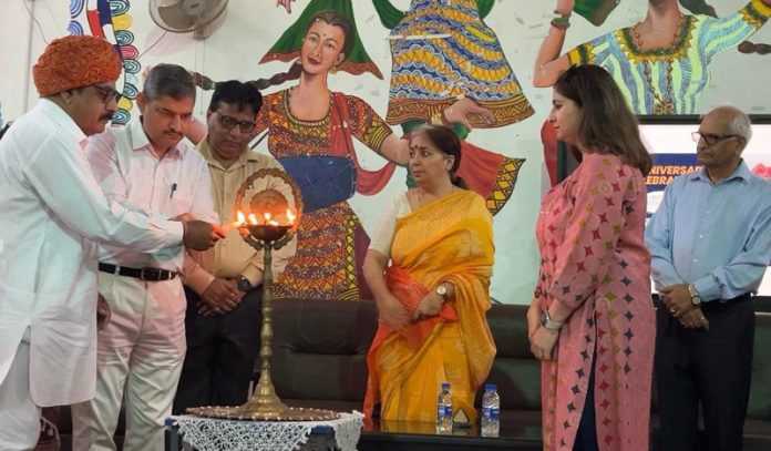 Dignitaries lighting ceremonial lamp while inaugurating a function at Shri Ranbir Model Higher Secondary School in Jammu.