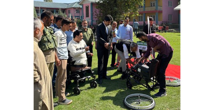 DC Anantnag Dr Syed Fakhruddin Hamid and functionaries of HWO during a wheelchair distribution program.