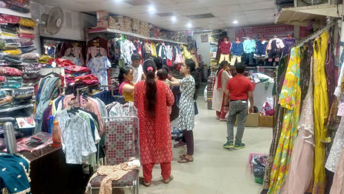 Customers busy in shopping at Vishal Mart in Jammu on Saturday.