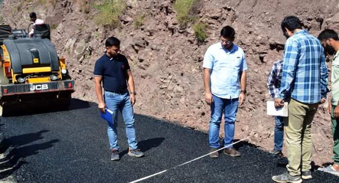 DC Poonch, Vikas Kundal inspecting work on a road.