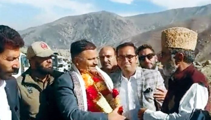 Minister Javed Ahmad Rana interacting with people during visit to Surankote on Sunday.