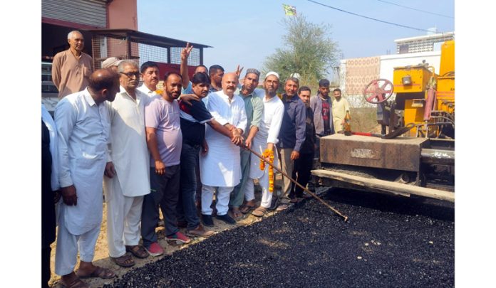 MLA Yudhvir Sethi inaugurating road blacktopping in Majeen Ragoora Jammu on Sunday.