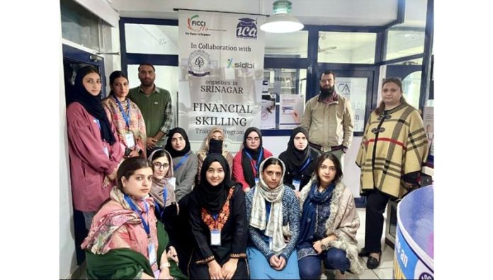 The women trainees posing for a group photograph along with their mentors.