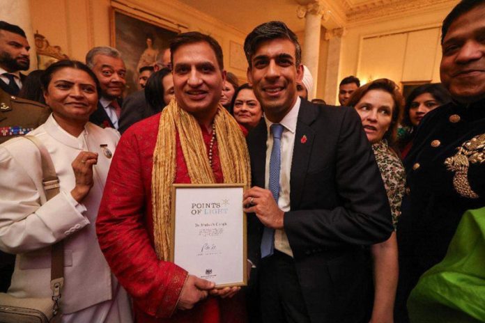 UK Prime Minister Rishi Sunak presenting MRANI award to Dr Mukesh Chugh.