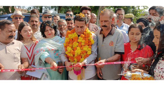 MLA Rajiv Jasrotia kick starting construction of lanes and drains in Panchayat Logate on Thursday.