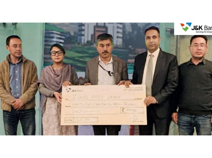 J&K Bank officials presenting a cheque to the family of one of the deceased borrowers in Ladakh Zone on Monday.