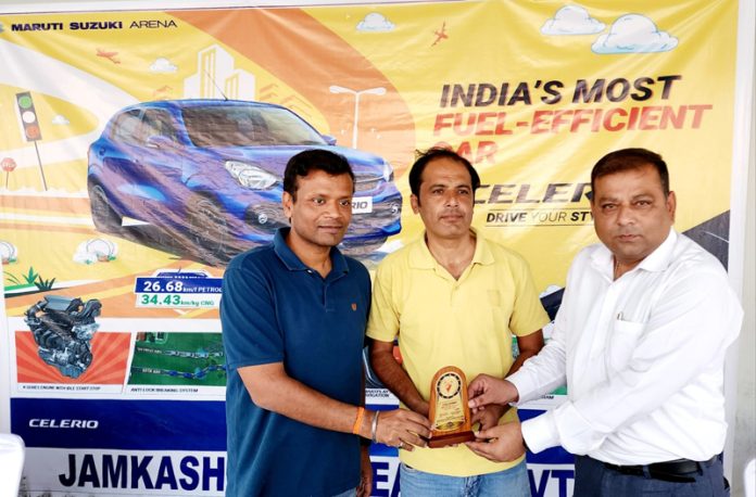 A dignitary from Maruti Suzuki Arena awarding a participant on Saturday.