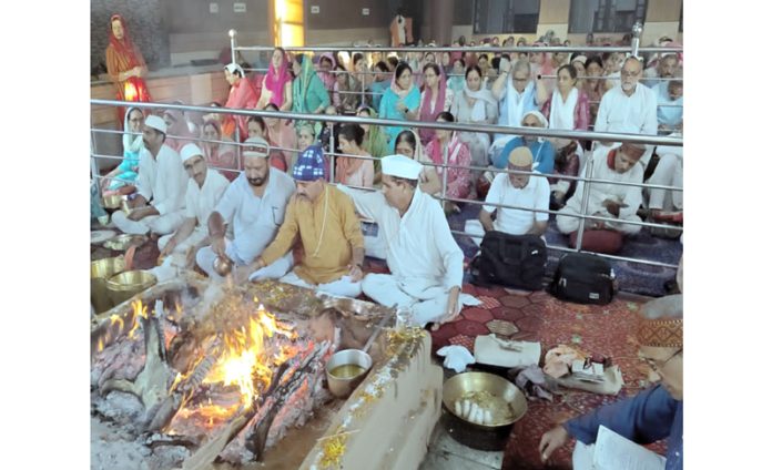 Devotees during concluding ceremony of 10 days religious programme at Bhagawaan Gopi Nath Ji Ashram Udheywala on Saturday.