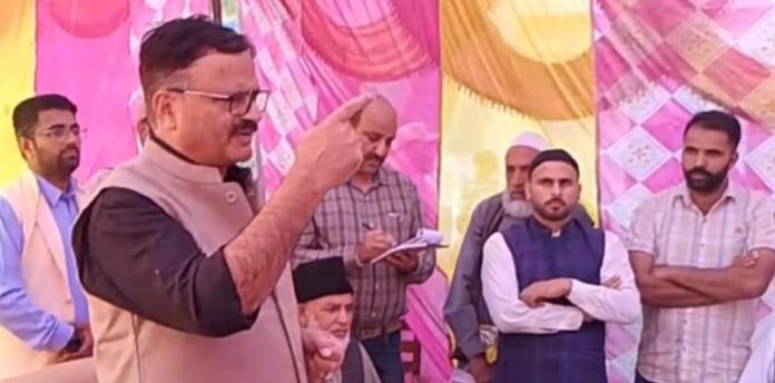 Minister for Jal Shakti Javid Ahmad Rana addressing public during visit to Mendhar on Monday.