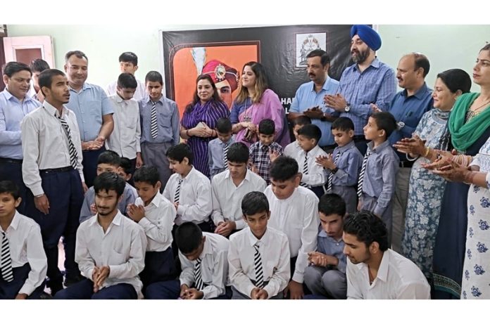 Ritu Singh, Trustee of the Maharaja Hari Singh Social & Educational Foundation posing with visually impaired students in Jammu on Wednesday.