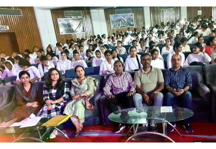 Mandar Teredesai, Chief Manager from Canara Bank posing along with others in Jammu on Monday.