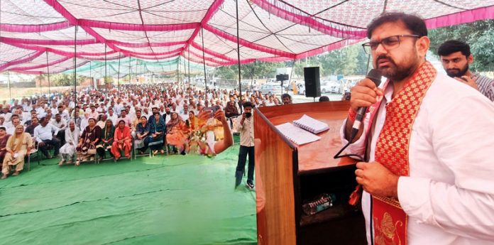 Minister Satish Sharma addressing a public meeting in Khour on Monday.