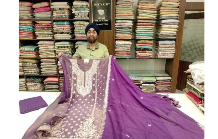 Jaspreet Singh Bahri, Founder of Angad Creations launching new collections at his store in Jammu on Thursday.