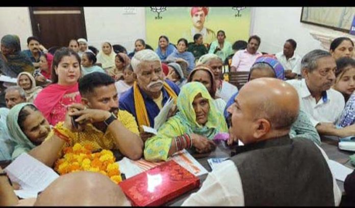 Yudhvir Sethi, MLA East constituency, listening to grievances during Janata Darbar at Pt. Prem Nath Bhawan on Thursday.