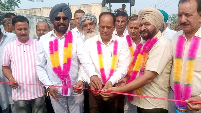 Prof Gharu Ram and Tony inaugurating work on a road from Gharana to Zero Line in Suchetgarh.