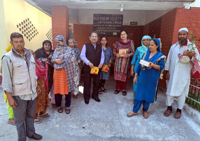 ARSH members distributing digital lamps at Kushta Ashram in Bhagwati Nagar.