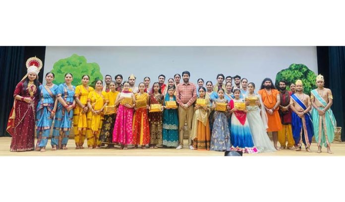 Young artists posing for a photograph with Natrang Director, Balwant Thakur at a function in Katra on Monday.