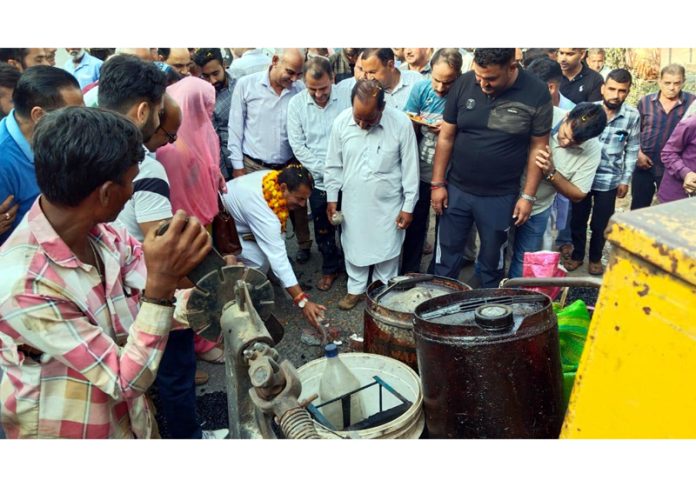 MLA R S Pathania inaugurating blacktopping of Samba to Mansar Road in Majalta on Wednesday.