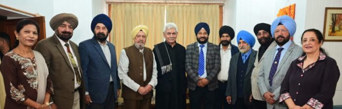 LG Manoj Sinha during meeting with a delegation at Raj Bhawan.