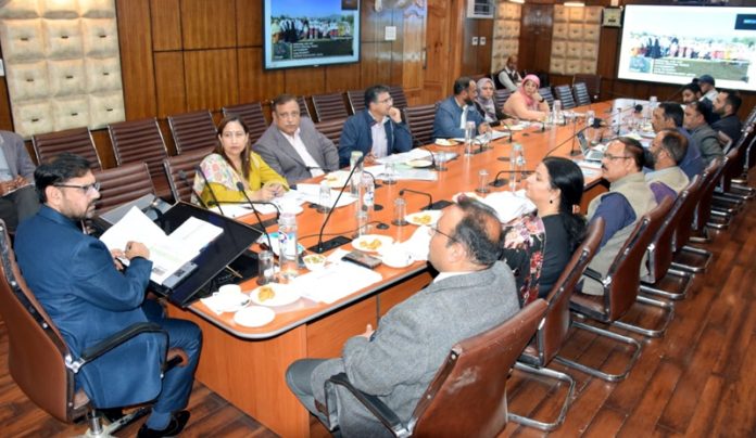 Minister for Science & Technology Satish Sharma chairing a meeting at Civil Secretariat Srinagar.