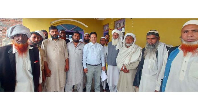 Javaid Rahi, Tribal Researcher with pastoral Gujjar, Bakkarwal Community during a programme at Jammu.