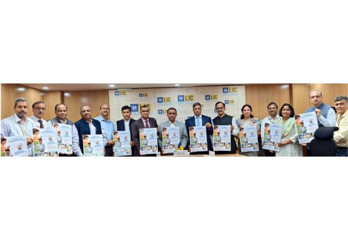 Dignitaries of LIC launching ‘Single Premium Group Micro Term Insurance’ plan at Mumbai.