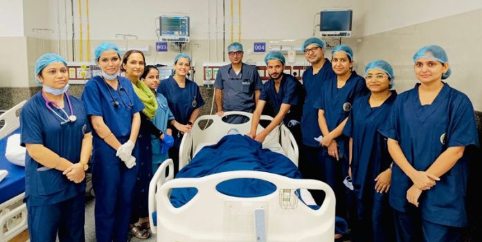 Surgical team of CTVS Department of AIIMS Jammu posing together after conducting 1st Femoro-Popliteal Bypass Surgery in the Institution.