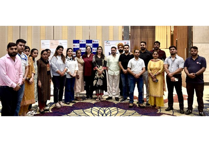 Dignitaries posing for a group photograph during a health camp organised by FICCI FLO JKL at Birpur on Tuesday.