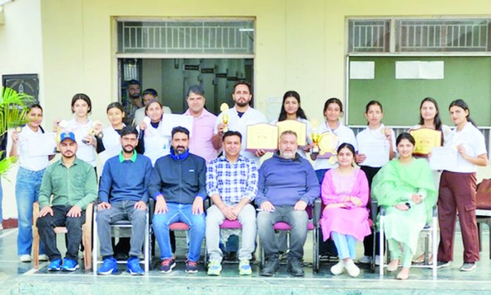 Jammu University Yoga team posing along with officials and supporting staff.