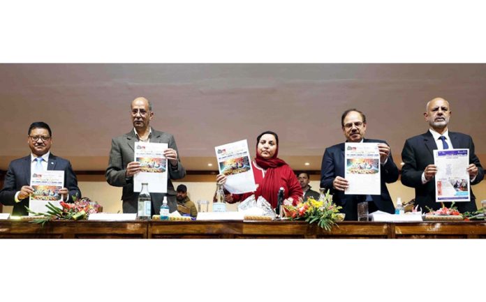 Minister Sakina Masood releasing CIED Annual Report during conclave at IUST.