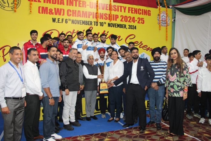 VC Jammu University Prof. Umesh Rai presenting trophy to winners. -Excelsior/Rakesh