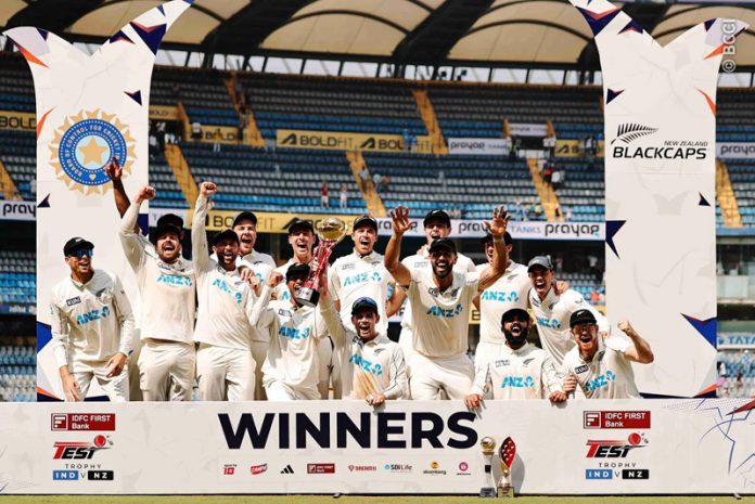 New Zealand cricket team celebrating while posing for a photograph along with trophy on Sunday.