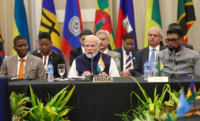 Prime Minister Narendra Modi speaks at the Second CARICOM-India Summit at Georgetown, Guyana on Thursday. Another pic on page 11. (UNI)