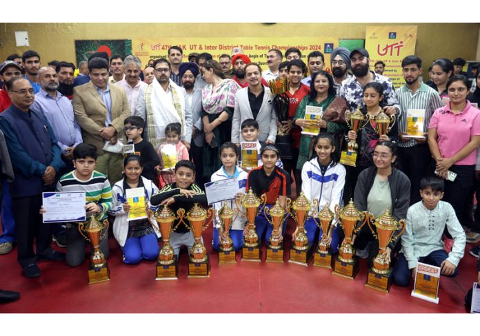 Minister for YS&S, Satish Sharma posing along with other dignitaries and Table Tennis players during prize distribution ceremony at Jammu. -Excelsior/Rakesh