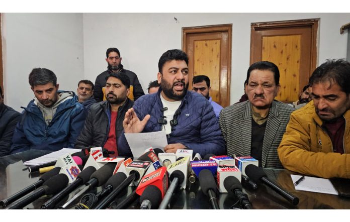 President J&K Casual Daily Wagers Forum, Sajad Parray alongwith others addressing a press conference in Srinagar on Monday. -Excelsior/Shakeel