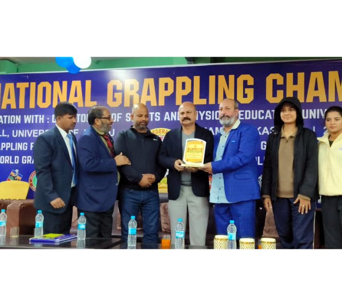 MLA Yudhvir Sethi along with others at the closing ceremony of Junior National Grappling Championship in Jammu on Tuesday.