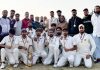 Players of Post Graduate team of Kashmir University pose for a photograph after winning Men's Inter-College Cricket Tournament.