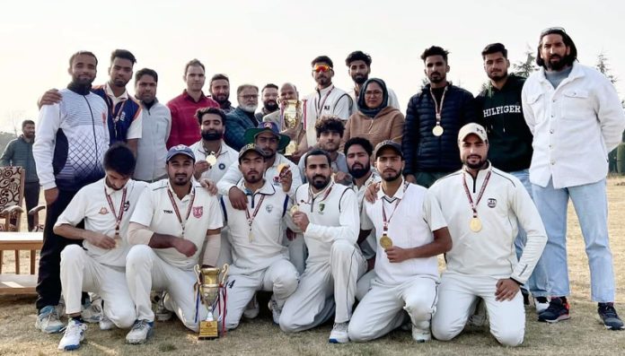 Players of Post Graduate team of Kashmir University pose for a photograph after winning Men's Inter-College Cricket Tournament.