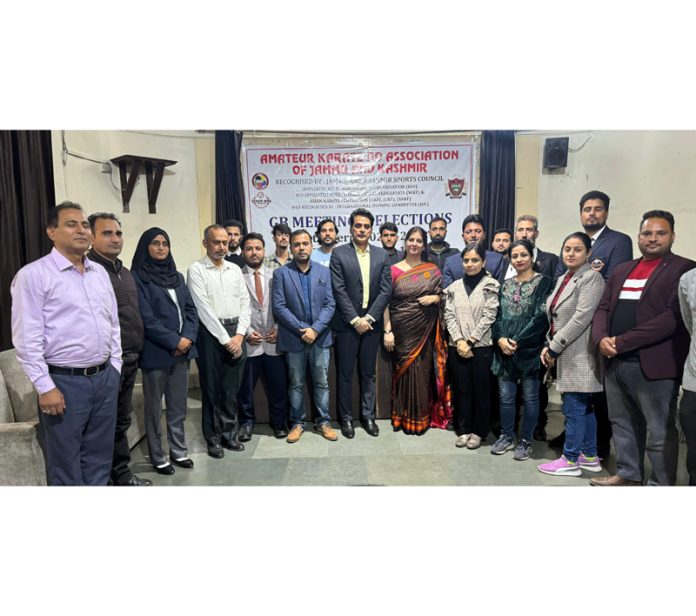 Newly elected team of Amateur Karate Do Association of J&K poses for a photograph with others at Jammu on Tuesday.