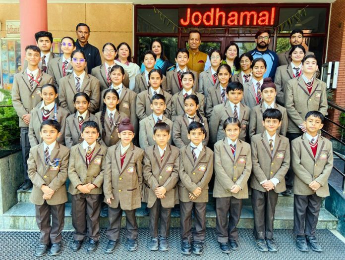 Skaters of Jodhamal Public School pose for a group photograph with their teachers.