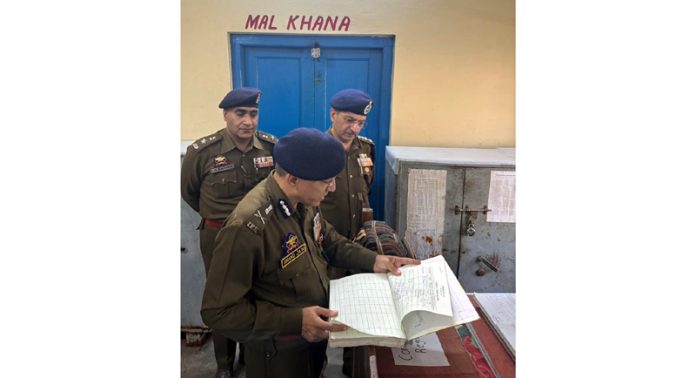 ADGP Jammu Anand Jain inspecting records at Police Station Bishnah on Sunday.