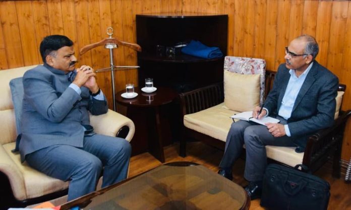 Minister Javed Ahmed Rana discussing environmental issues with PCB Chairman.