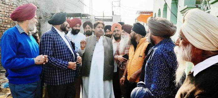 J&K Cong working president Raman Bhalla interacting with people at Simbal Camp in Jammu South.