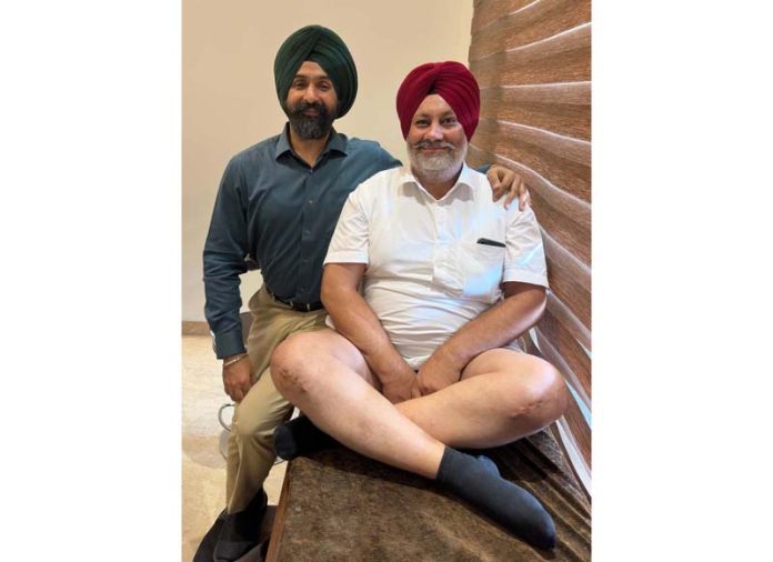 Dr Ranjeet Singh posing with a patient on whom he performed full knee replacement surgery.