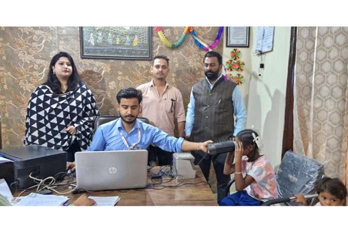 Children of Shelter Home for Boys, Trikuta Nagar and others during an Aadhaar Enrolment Camp on Friday.