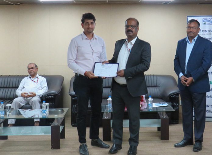 Managing Director CVPPPL, Ramesh Mukhiya presenting certificate during a programme.